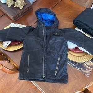 White Sierra Black ski Jacket with Blue Lining. Water resistant